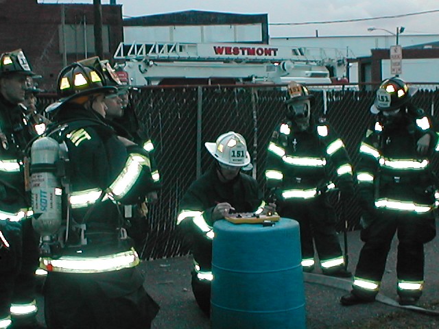 Members of the Westmont Fire Company prepare to enter an abandoned building for rescue company operations.