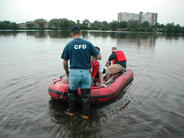 Lt. John Young assists a crew as they prepare to take a ride on the Cooper River.