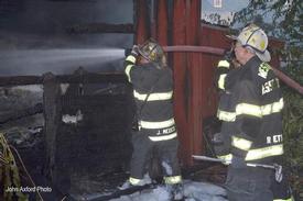     
(Haddonfield) May 18, 2012: Chief John Medes hits some hot spots as Assistant Chief Rick Etter looks on. 
